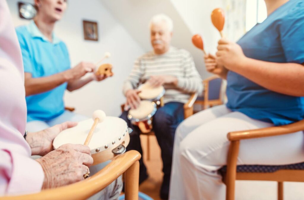 seniors in memory care enjoying the group recreational activities playing musical instruments